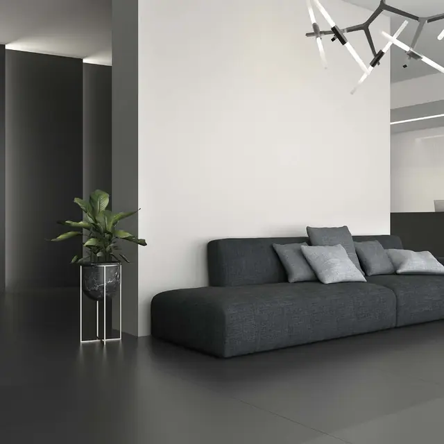 Porcelain slab wall behind a living-room sofa